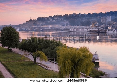 View of floating bars and nightclubs on Sava River across to Victor Monument at Belgrade Fortress, Belgrade, Serbia, Europe Royalty-Free Stock Photo #2448660989