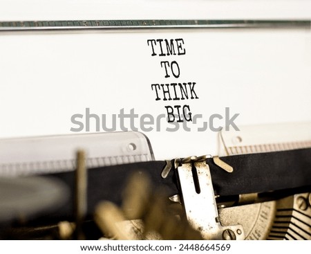 Time to think big symbol. Concept words Time to think big typed on beautiful old retro typewriter. Beautiful white background. Business and time to think big concept. Copy space.
