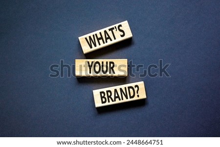 Branding and what is your brand symbol. Concept words What is your brand on beautiful blocks. Beautiful black table black background. Business branding what is your brand concept. Copy space.