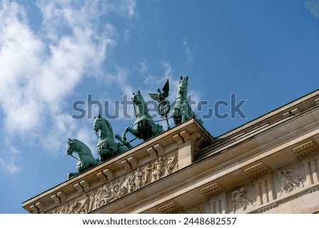Statue of cavalry located on the Brandenburg Gate. Brandenburg Gate close-up. Royalty-Free Stock Photo #2448682557