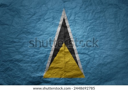 colorful big national flag of saint lucia on a grunge old paper texture background