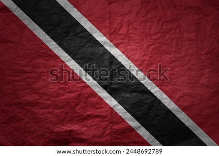 colorful big national flag of trinidad and tobago on a grunge old paper texture background