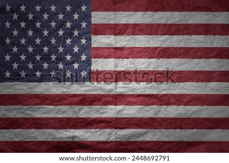 colorful big national flag of united states of america on a grunge old paper texture background