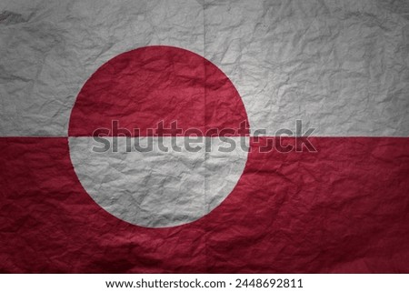 colorful big national flag of greenland on a grunge old paper texture background