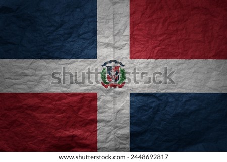 colorful big national flag of dominican republic on a grunge old paper texture background