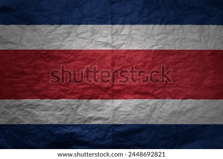 colorful big national flag of costa rica on a grunge old paper texture background