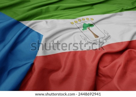 waving colorful national flag of equatorial guinea. macro shot
