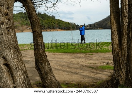 Nature walking and photography activity. Borabay lake hiking trail 2024. Male figure.