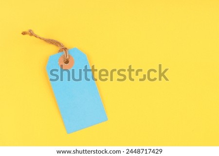 Blank price tag on yellow background, Position with copy space.