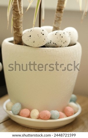 the flower pot is decorated with Easter decor