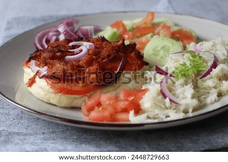Ultimate Pulled Chicken Pita Pizza: Loaded with Tomatoes, Red Onions, and Crème Fraîche, Served with Fennel Salad and Cucumber