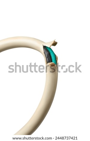 close-up of damaged electric wire cord isolated white background,broken power cable exposed wiring poses serious dangers,fire hazard and short circuit Royalty-Free Stock Photo #2448737421