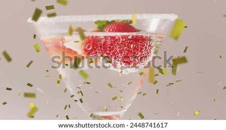 Image of confetti falling and cocktail on white background. Party, drink, entertainment and celebration concept digitally generated image.