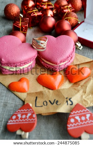 pink French macarons heart-shaped .love letter,Valentine,pr oposal,ring,red hearts,Valentine's day.wooden background