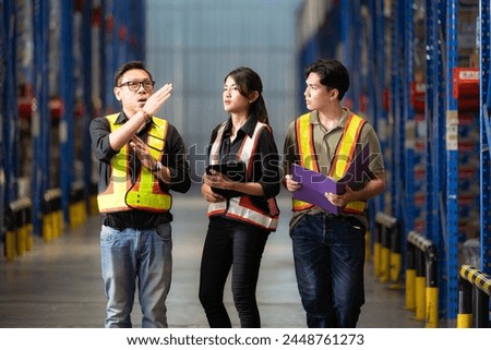 A group of warehouse employees, Inspecting products on warehouse shelves before they are sent to retailer