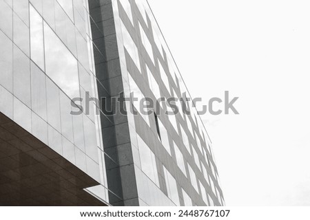 Modern building facade on gray background