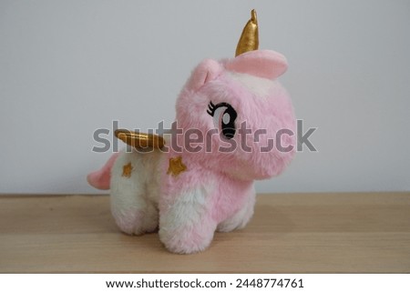 Rainbow colored unicorn doll made from Dacron