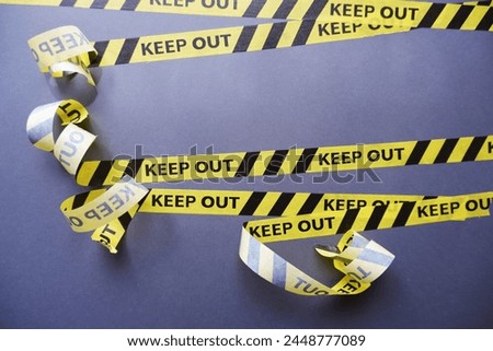Keep out, police line on dark background. Caution lines isolated. Warning tapes. Danger signs. Royalty-Free Stock Photo #2448777089