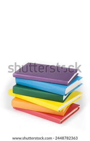 Book stacking. Open book, hardback books on white background. Back to school. Copy space for text