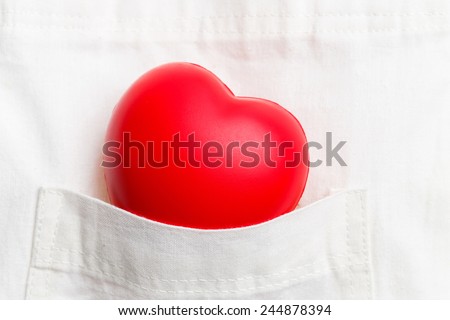 Close up red color  heart in cloth pocket