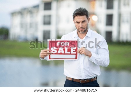 Businessman buying and selling houses and real estate. real state agent giving new house key. Estate agent with customer before contract signature. male real state agent with a for sale or rent sign.