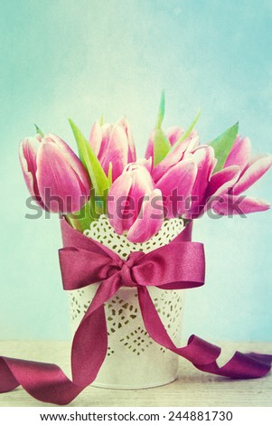Beautiful tulips bouquet on wooden table. 