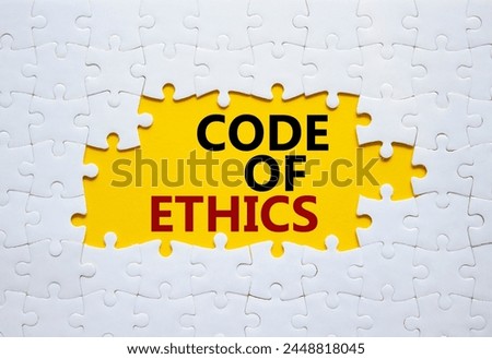 Code of ethics symbol. Concept words Code of ethics on white puzzle. Beautiful yellow background. Business and Code of ethics concept. Copy space.