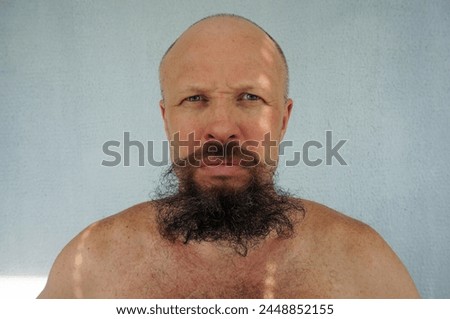 Men's beard. The guy's face is large. Brutal macho. Mustache and beard. Barber. Lumberjack. Portrait of a handsome man with a beard                                Royalty-Free Stock Photo #2448852155
