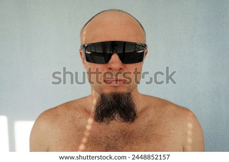 Men's beard. The guy's face is large. Brutal macho. Mustache and beard. Barber. Lumberjack. Portrait of a handsome man with a beard                                Royalty-Free Stock Photo #2448852157
