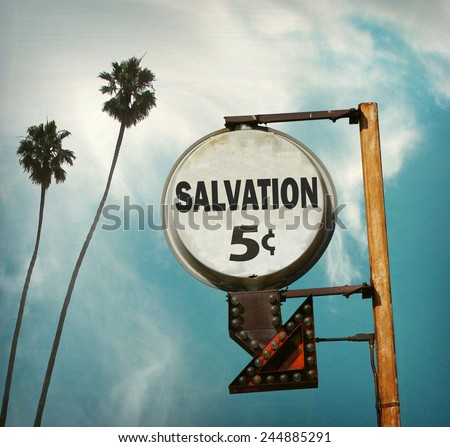 aged and worn vintage photo of salvation sign with palm trees