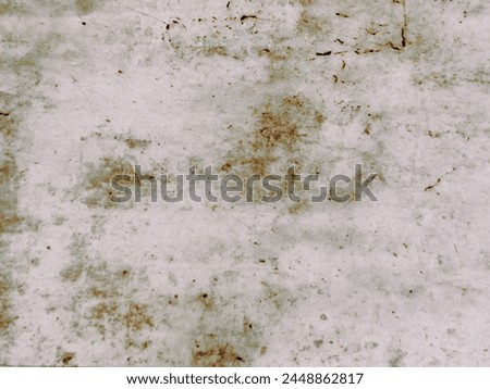 an abstract pattern on a wall resulting from a layer of white plaster