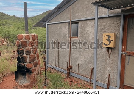 Picture of a historical hot water supply for a house via an external fireplace in Africa