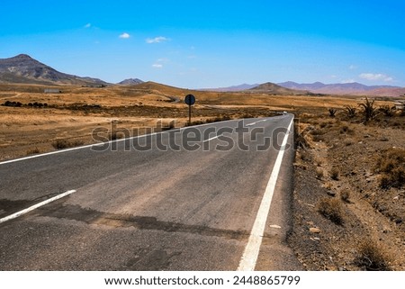 Photo Picture of a Beautiful Asphalt Lonely Road Royalty-Free Stock Photo #2448865799