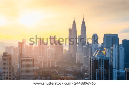 Panorama view of Kuala Lumpur business distric skyscraper with colorful sunrise sky background, Malaysia. Royalty-Free Stock Photo #2448896965