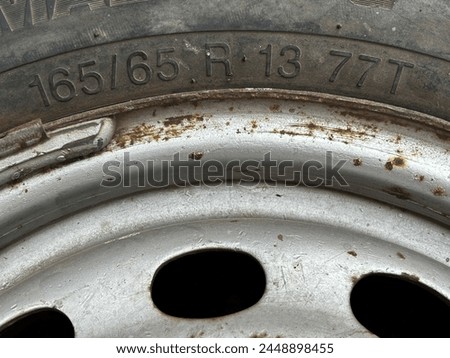 Closeup of text 16565 showing width and aspect ratio of a tyre. Royalty-Free Stock Photo #2448898455