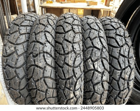 Stock photo,Full frame shot of tires dispalyed for sell.