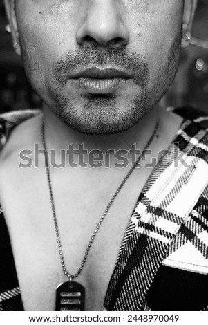 Confident Indian man showcasing his chest, exuding strength and charisma. Ideal for fitness, lifestyle, and masculinity concepts Royalty-Free Stock Photo #2448970049