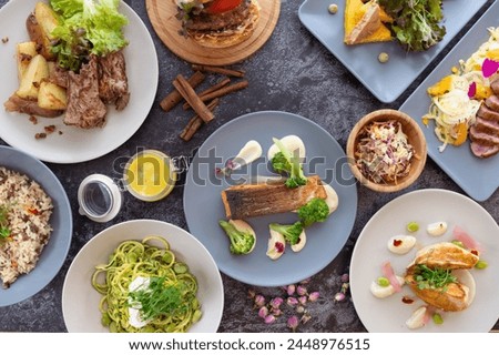 Table with healthy food: Vibrant assortment of fresh fruits, veggies, lean proteins, and whole grains, providing a nutritious meal for health-conscious individuals. Royalty-Free Stock Photo #2448976515