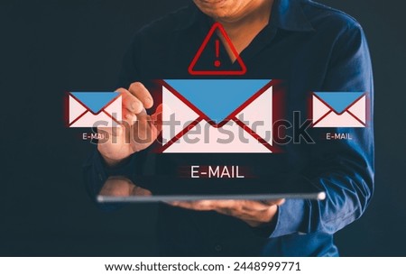 Men's hands use tablets, with email icons, spam, spam links, viruses, email icons, themes, holographic technology, and virtual screens of smartphone hackers. Royalty-Free Stock Photo #2448999771