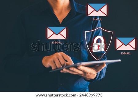Male hand using tablet with spam email icon Mobile spam links Virus email icon on smartphone virtual screen holographic technology theme. Hacker. Data protection. Royalty-Free Stock Photo #2448999773