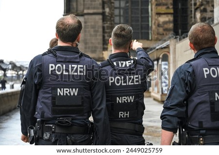 Special police forces of Germany. Police officers in uniform patrol the city. A group of police officers in the city. Policeman. 