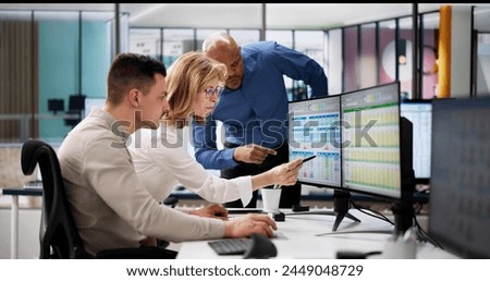 Analyst Employee Working On Spreadsheet Using Desktop Computer Royalty-Free Stock Photo #2449048729