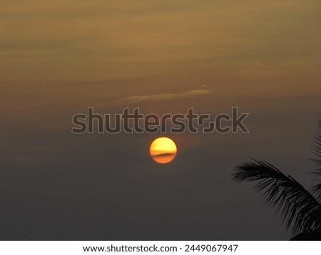 dusky view of the setting sun during sunset in the evening Royalty-Free Stock Photo #2449067947
