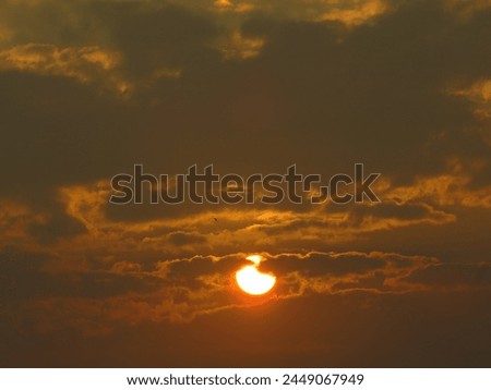 dusky view of the setting sun during sunset in the evening Royalty-Free Stock Photo #2449067949