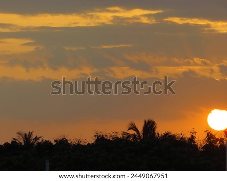 dusky view of the setting sun during sunset in the evening Royalty-Free Stock Photo #2449067951
