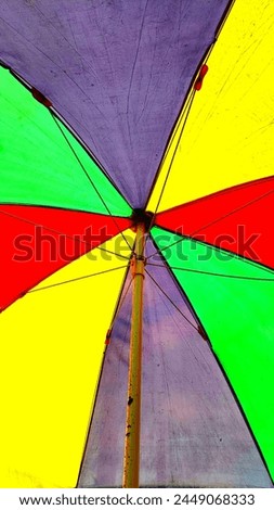 Very bright colorful umbrellas at the beach