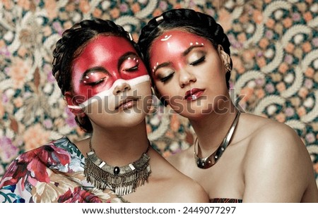 Tribal, makeup and culture of Native American Indian women with pride in beauty, face paint and jewelry. Traditional, models and indigenous costume of warrior spirit in fashion with pattern on skin