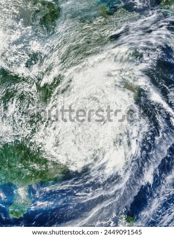 Remnants of Typhoon Soudelor 13W over China. Remnants of Typhoon Soudelor 13W over China. Elements of this image furnished by NASA. Royalty-Free Stock Photo #2449091545