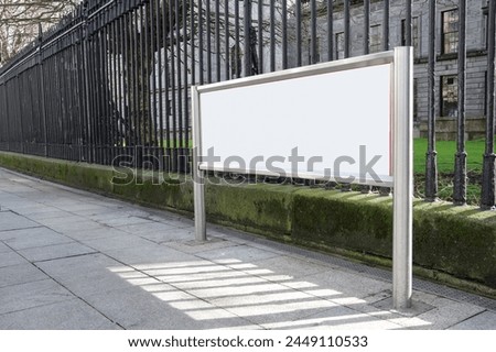 Blank white banner for advertisement on the fence and the park