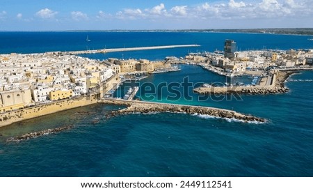 Aerial view of Gallipoli, drone view at the old town with fort, ramparts and harbor, Lecce province, Salento peninsula, Puglia, south Italy. Gallipoli historic center seen from another perspective.